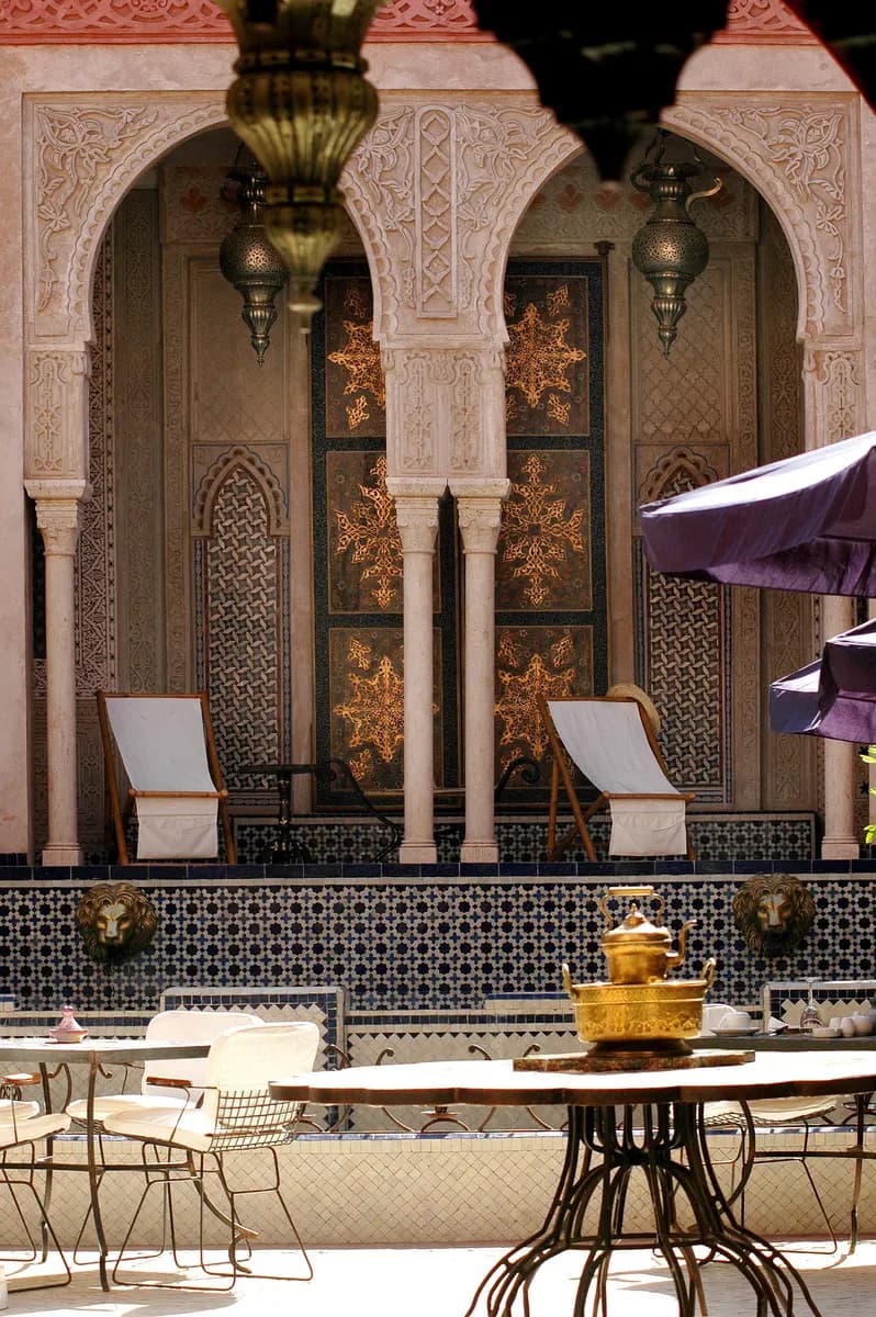 BookNoFees sample image: Riad courtyard with plants and seating areas