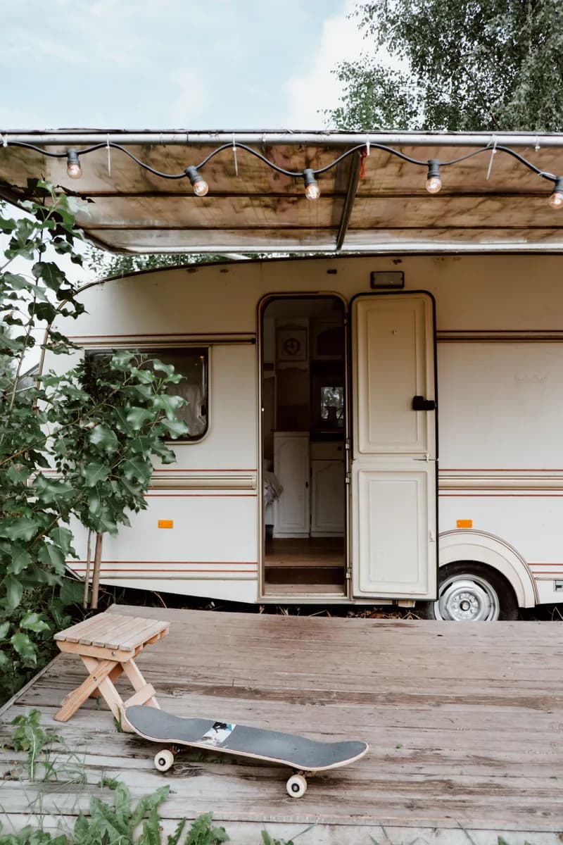 BookNoFees example image: A trailer with an open door next to a wooden deck